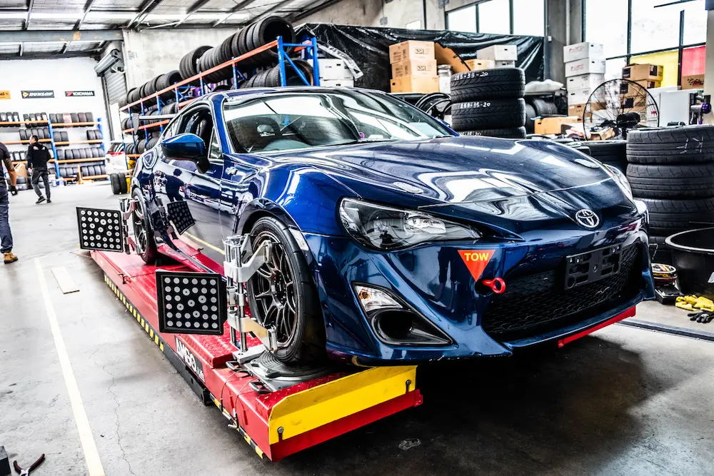 Mechanic performing a wheel alignment